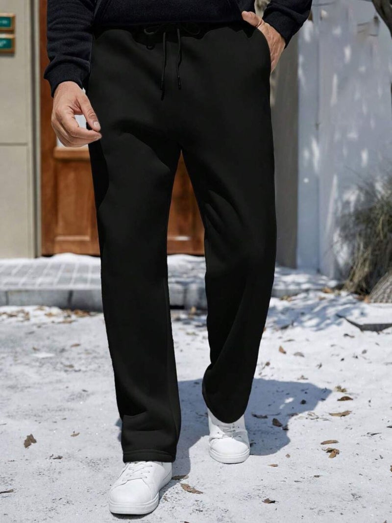 فلاينوف بنطلون رياضي رجالي أسود سادة بقصة فضفاضة - Image 1